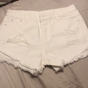 White distressed jean shorts